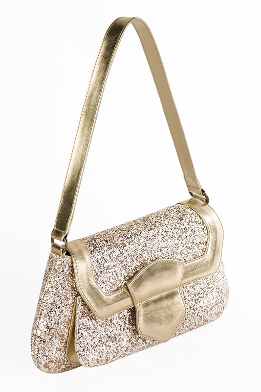 Gold women's dress handbag, matching pumps and belts. Worn view - Florence KOOIJMAN